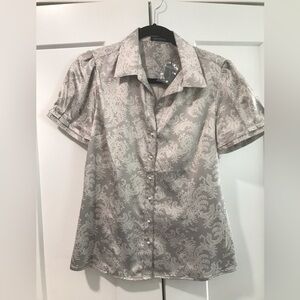 The limited button up top